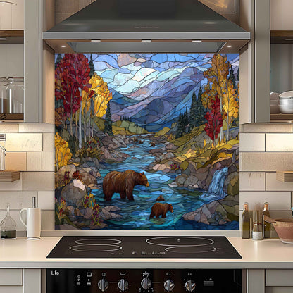 Kitchen with a decorative glass splashback featuring a bear and bear cubs by a stream.