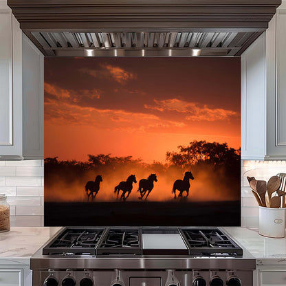 Kitchen stove with a decorative backsplash featuring silhouettes of horses running at sunset.