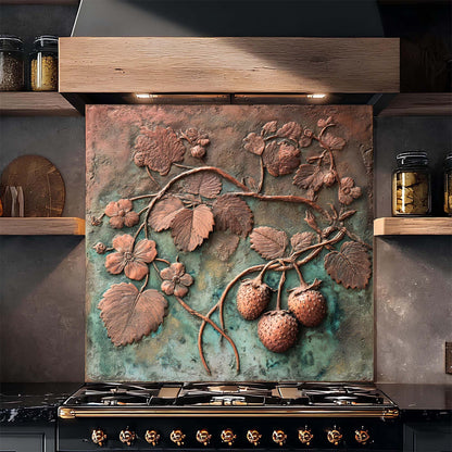 Decorative copper look glass backsplash with floral and berry design above a stove.