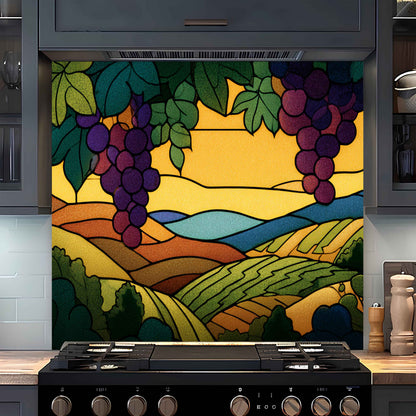 Decorative backsplash with stylized landscape and grapes above a stove in a kitchen.