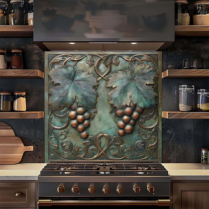 Decorative backsplash with grape design above a stove in a kitchen setting.
