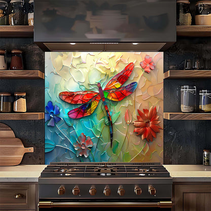 Colorful dragonfly and floral design on a kitchen backsplash above a stove.