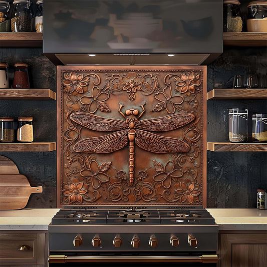 Decorative copper look glass backsplash with floral and dragonfly design above a stove in a kitchen.
