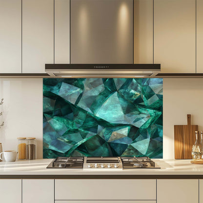 Kitchen with a decorative glass splashback featuring geometric blue patterns.