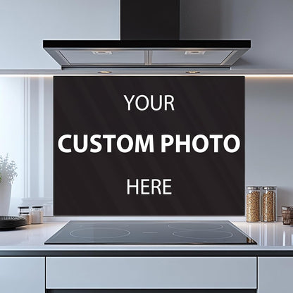 Modern kitchen with a custom photo design on a black backsplash.