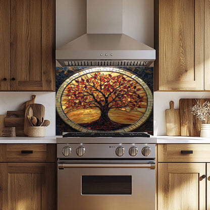 Stainless steel oven with decorative glass backsplash featuring a tree design in a kitchen setting.
