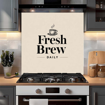 Kitchen with a 'Fresh Brew Daily' glass backsplash above a stove