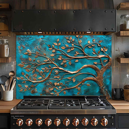 Stainless steel gas stove with decorative blue and bronze leaf design on the glass backsplash