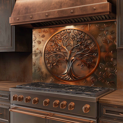 Stainless steel stove with copper accents and a decorative tree design on the back splash.