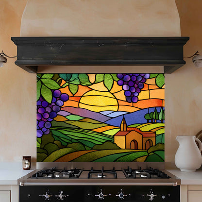 Colorful stained glass-style backsplash with a landscape design above a stove.