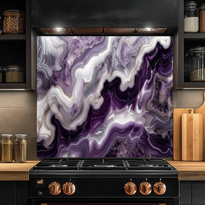 Stainless steel stove with a purple and white abstract design backsplash in a kitchen setting.