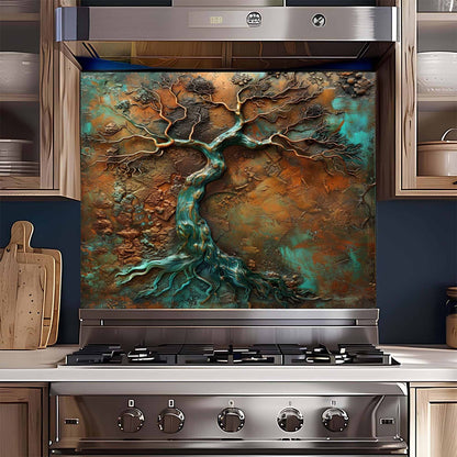 Stainless steel stove with decorative backsplash featuring a tree design in a kitchen setting.