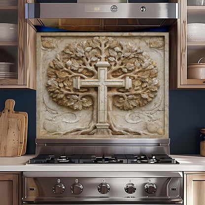 Stainless steel stove with decorative backsplash featuring a cross and tree design.