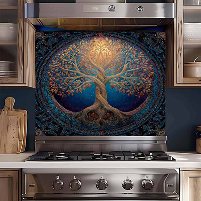 Stainless steel oven with a decorative tree of life design on the glass back splash.