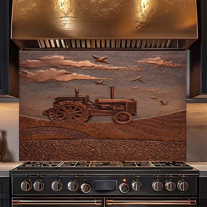 Stainless steel range hood with embossed tractor design on a glass backsplash