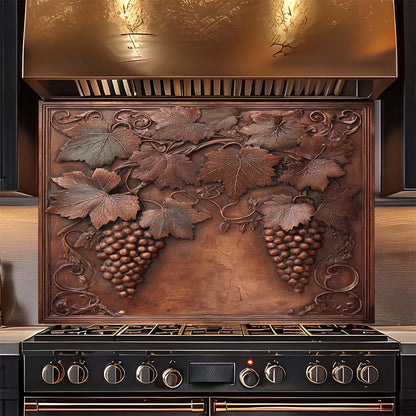 Decorative copper look glass backsplash with grapevine design above a stove.