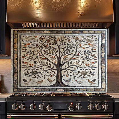 Decorative backsplash above a stove with a tree design and birds.