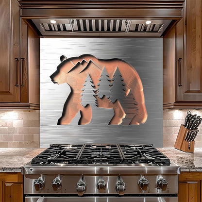 Stainless steel stove with bear and tree design on backsplash in a kitchen setting