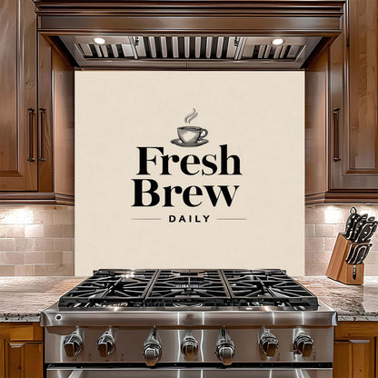 Kitchen with a stove and 'Fresh Brew Daily' glass backsplash