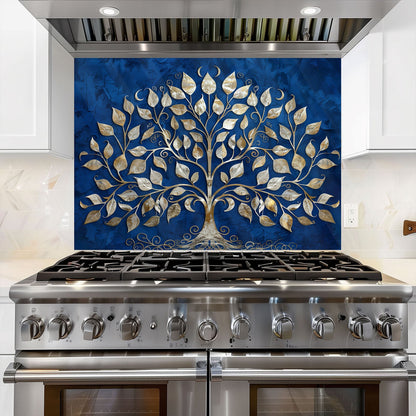 Stainless steel stove with decorative glass splashback featuring a tree design on a blue background.