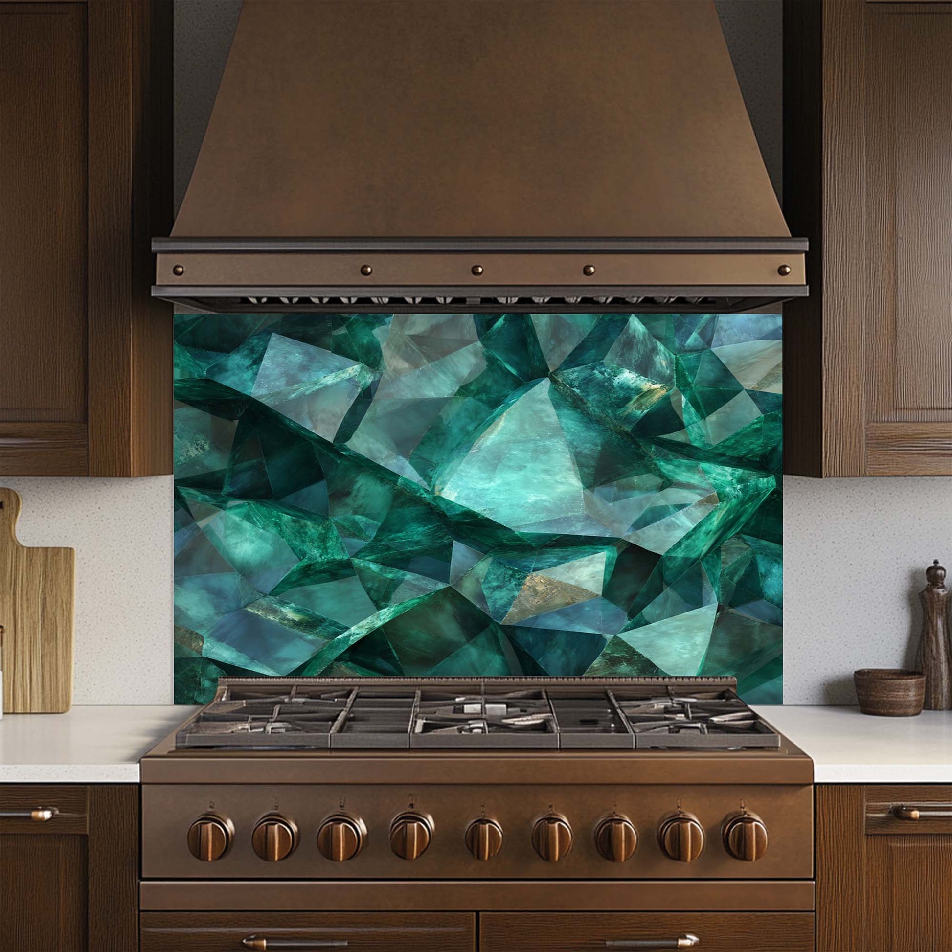 Kitchen stove with a decorative green glass backsplash and brown hood