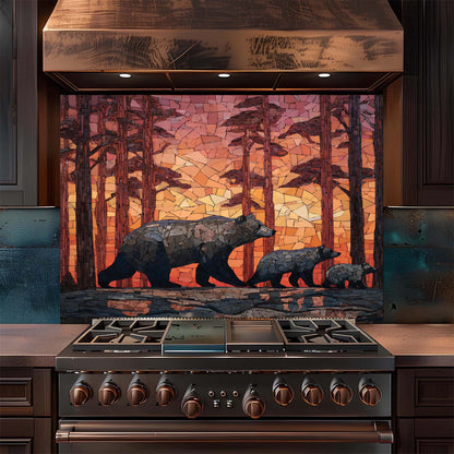 Stainless steel stove with a decorative glass backsplash featuring bears in a forest design.