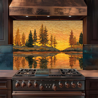 Stainless steel stove with decorative glass panel featuring a sunset over water and trees