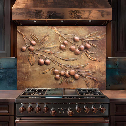 Stainless steel stove with decorative copper look glass backsplash featuring olive branch design.