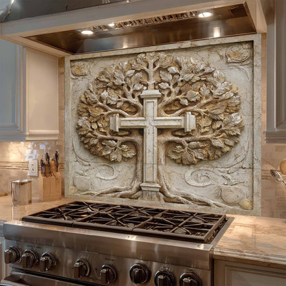 Decorative backsplash with a cross and tree design above a stove in a kitchen.