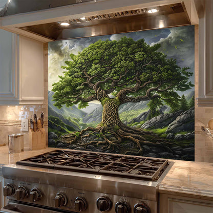 Stainless steel stove with a decorative wall panel featuring a tree and mountain landscape.