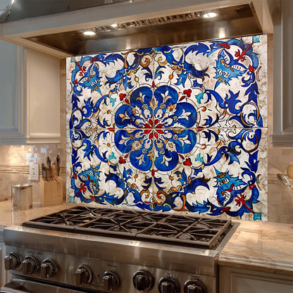 Decorative tile backsplash with intricate patterns above a stove in a kitchen.